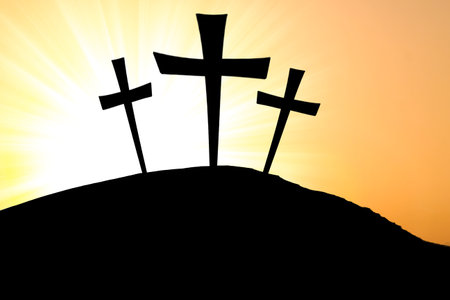 Silhouette cross on Calvary mountain sunset background. Easter conceptの写真素材