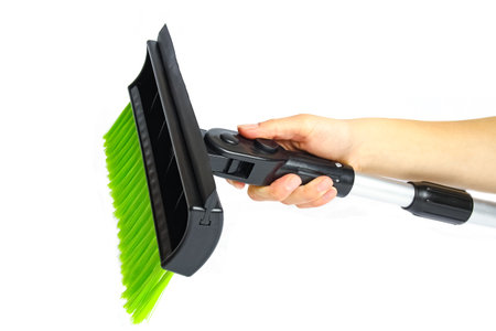 stylish brush in hand for car winter snow on a white background