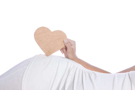 Happy pregnant girl lies on white background