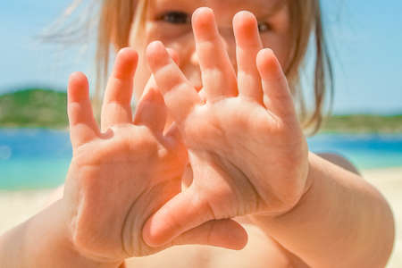 happy kids playing by the sea on nature backgroundの写真素材