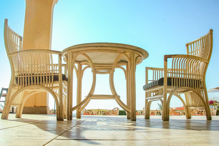 Chairs with table for eating people business background sea on summer vacation.の写真素材