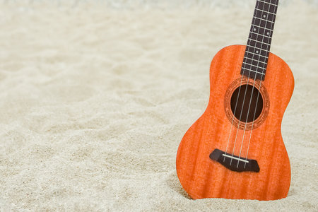 beautiful guitar on the sand by the Greek seaの写真素材