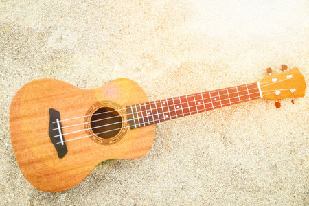 beautiful guitar on the sand by the Greek sea