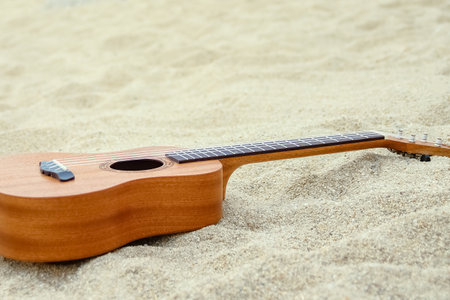 beautiful guitar on the sand by the Greek seaの写真素材