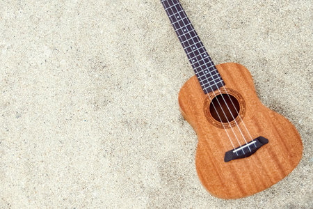 beautiful guitar on the sand by the Greek seaの写真素材