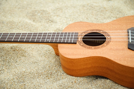 beautiful guitar on the sand by the Greek seaの写真素材