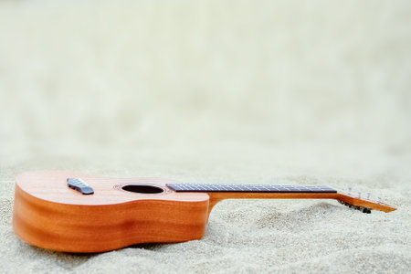 beautiful guitar on the sand by the Greek seaの写真素材