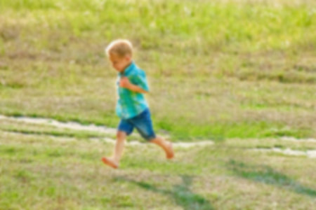 Happy children playing on nature in summerの写真素材