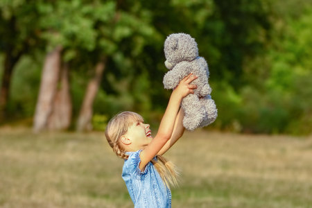 Happy child playing in nature in summerの写真素材