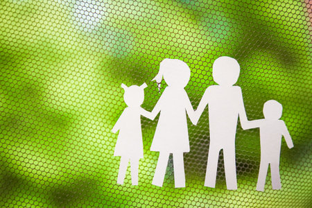 paper family on a background of grassの写真素材