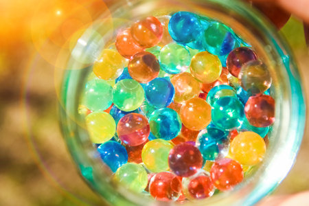 nice background of different colors balls in hands