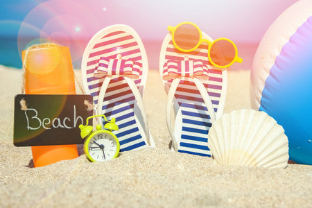 beautiful slippers in the sand of the sea in Greece backgroundの写真素材