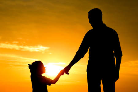 happy dad with a child in the park outdoors silhouetteの写真素材