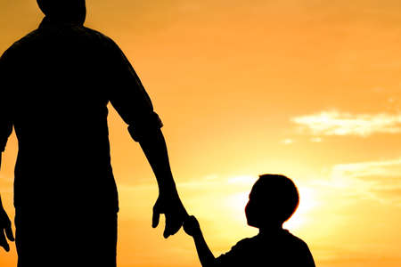 happy dad with a child in the park outdoors silhouetteの写真素材