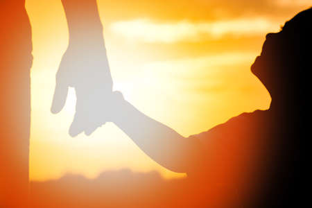 happy dad with a child in the park outdoors silhouetteの写真素材