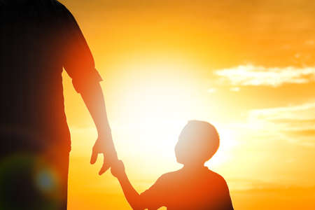 happy dad with a child in the park outdoors silhouetteの写真素材