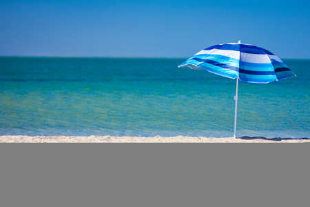 Beautiful umbrella near the seashore on nature in the park background