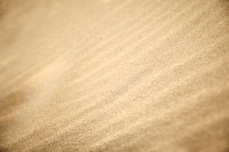 Sand by the sea on vacation traveling background.