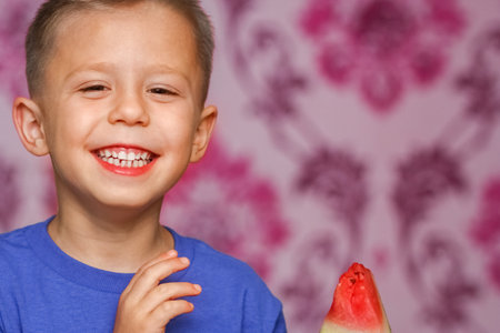 happy baby with watermelon at homeの写真素材