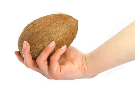 beautiful and delicious coconut in hands on a white backgroundの写真素材
