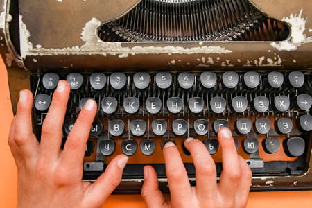 old typewriter with hands antiqueの写真素材