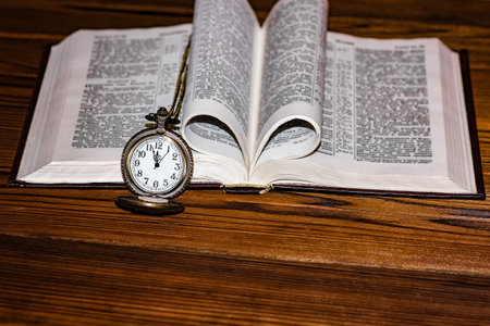 pocket watch with book backgroundの写真素材