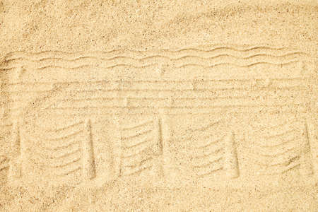 Drawing in the sand near the sea in nature travel background. Hand drawn on vacation.の写真素材