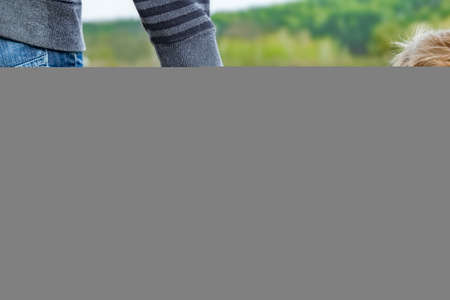 beautiful hands of parent and child outdoors in the park