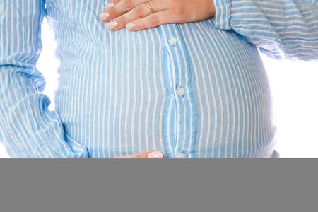 Happy pregnant girl lies on white background