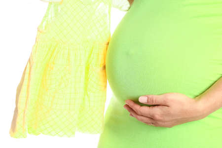 Happy pregnant girl lies on white backgroundの写真素材