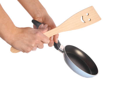 pan in hands on a white backgroundの写真素材