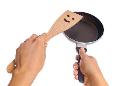 pan in hands on a white backgroundの写真素材