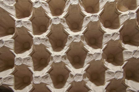 Egg tray made from recycled miscellaneous paper backgroundの写真素材