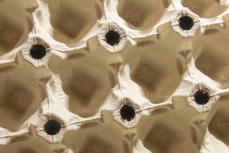 Egg tray made from recycled miscellaneous paper background