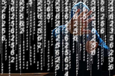Hacker with laptop and abstract binary code.