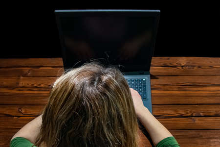 Hacker with laptop and abstract binary code.の写真素材