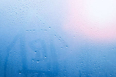 house painted on glass window with drops background