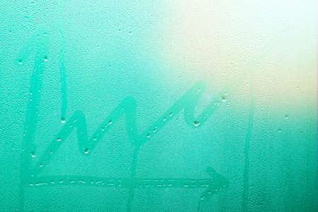 business chart on window glass with drops backgroundの写真素材