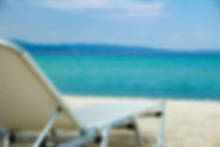 beautiful beach chairs near the seashore of Greece on the nature background
