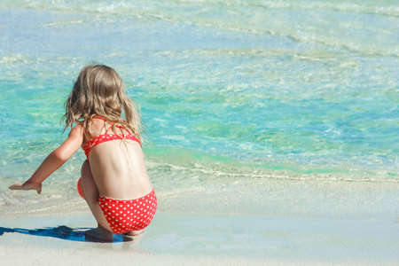 happy child playing by the sea outdoorsの写真素材