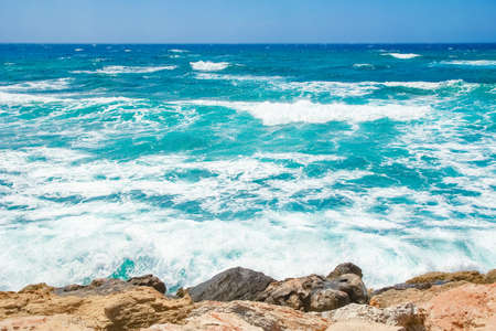 beautiful beach with waves in the nature of the backgroundの写真素材