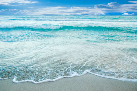 beautiful beach with waves in the nature of the backgroundの写真素材