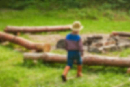 happy baby cowboy in natureの写真素材