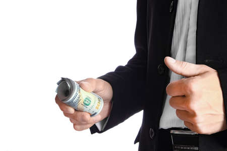 Business man holding money on white backgroundの写真素材