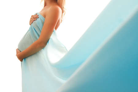 pregnant belly on white background with blueの写真素材