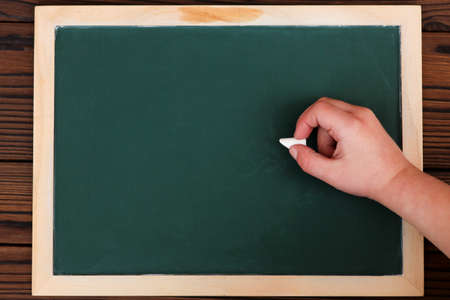chalk board green school study and child hand with chalk