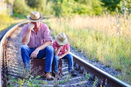 father and son cowboys concept happiness togetherの写真素材