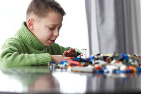 boy playing with cubes idea smart development block emotions