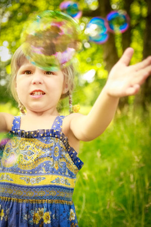 happy child having fun playing in the nature parkの写真素材