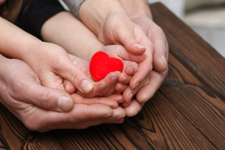 Heart in hands on valentine's day concept famiy loveの写真素材